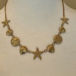 14K gold sea shell necklace approx 17” long starfish sand dollars $ shells